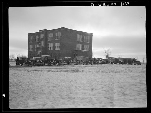 School buses in front of consolidated school. Lake Center, Clay County, Iowa