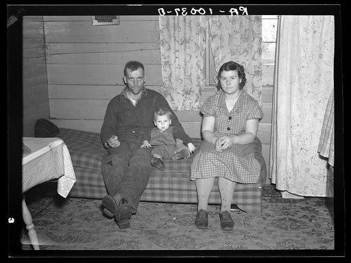 William Helmke, wife, and baby in one-room shack which he erected on ninety acre farm. Crop share lease owned by lawyer. Iowa