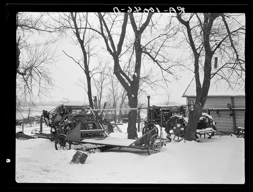 Machinery standing in open for lack of adequate shelter. Nelson Brothers farm, one hundred ninety-seven acres, near Dickens, Iowa