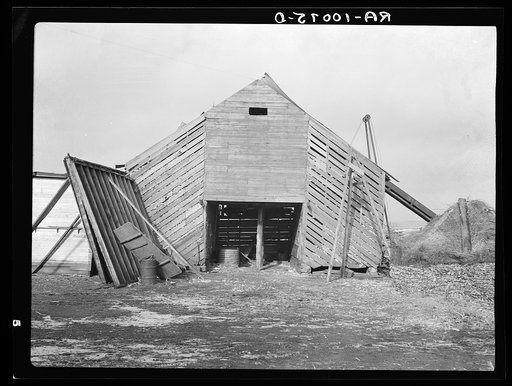 Corn crib on J.E. Herbrandson farm. One hundred sixty acres, owner-operated, near Estherville, Iowa. The necessity of making payments on a heavy mortgage has caused their buildings to be in bad repair