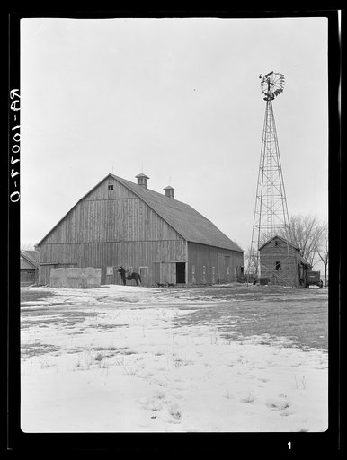 Tremendous barn, sixty by one hundred feet, and windmill on Roy Merriot farm of three hundred twenty acres near Estherville, Iowa