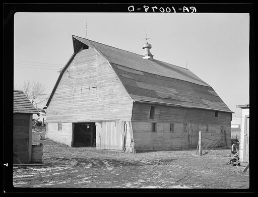Barn on J.E. Herbrandson farm near Estherville, Iowa. Owner-operated. This farm is under heavy mortgage. It was bought originally at two hundred dollars per acre in fall of 1919. Pressure to keep up payments has resulted in general disrepair. Payments made up to April, 1936. Owner had to sell this y