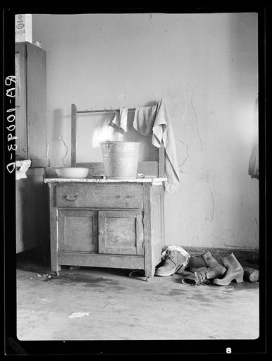 Washstand in corner of kitchen of Edgar Allen's home on farm near Milford, Iowa. Contrast this with washstand picture of Harry Madsen farm, tenant house