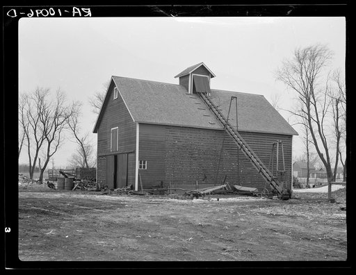 Corn crib on Rex Inman farm near Estherville, Iowa. This farm owned by a loan company