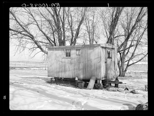 Trailer house owned by Clifford Blum. They lived in this for one year while he was farming eighty acres without buildings