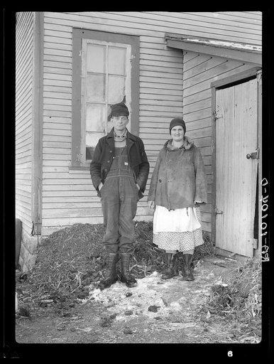 Edgar Allen and his wife at the rear of house on farm near Milford, Iowa
