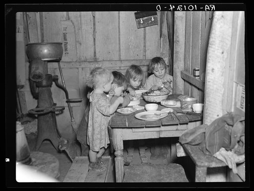Christmas dinner in home of Earl Pauley. Near Smithland, Iowa. Dinner consisted of potatoes, cabbage and pie