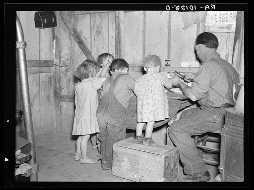 Christmas dinner in home of Earl Pauley. Near Smithland, Iowa. Dinner consisted of potatoes, cabbage and pie