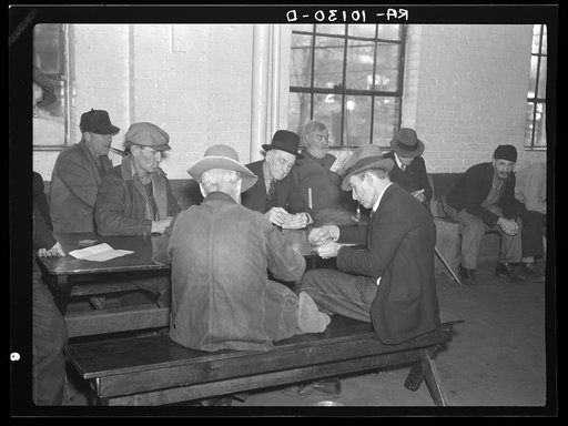 A card game in the recreation room of the homeless men's bureau. Sioux City, Iowa (for unattached men)