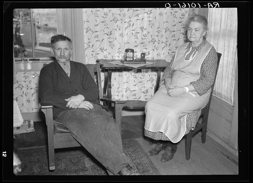 George Finkle and wife in their home near Marseilles, Illinois. Finkle once owned two hundred forty acres of good farmland which he lost to an insurance company