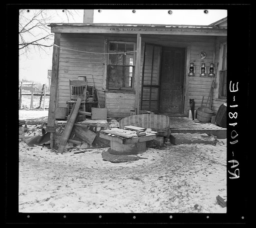Backyard and porch of Fred Morgenflash's farmhouse near Marseilles, Illinois