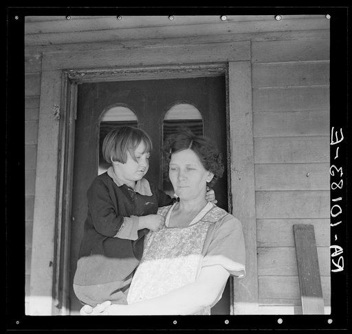 Mrs. Fred Morgenflash and youngest of her six children. Morgenflash rents fifty-one acres from a private party. Near Marseilles, Illinois