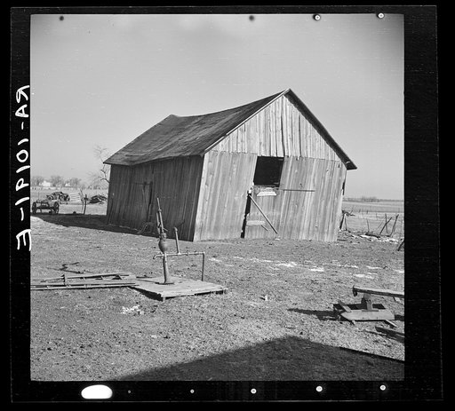 Pump and barn on George Erickson's farm near Seneca, Illinois. This one hundred twenty acre farm is farmed for the land. No one lives in the house
