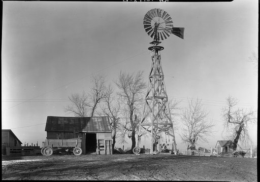 Old-style wooden windmill in farmyard of Martin Myre's farm near Seneca, Illinois