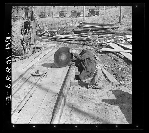 Sighting a circular saw blade at country sawmill near Omaha, Illinois