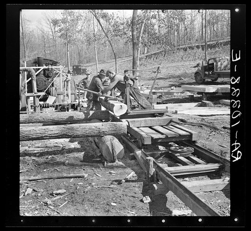 Turning the log at the country sawmill near Omaha, Illinois
