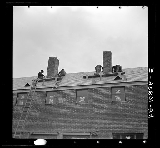 Men working on flashing of chimney. Greenhills, Ohio