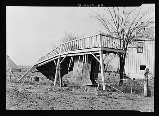 This porch was torn off the house in the background by the 1937 flood. Near Mount Vernon, Indiana