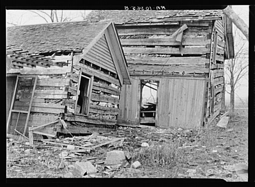 Log cabin farmhouse after the flood had swept through it. On Mackey Ferry Road near Mount Vernon, Indiana