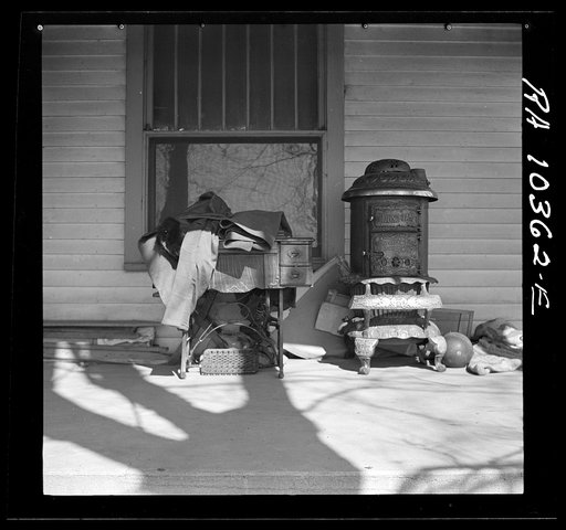 Furniture being moved out of the farmhouse of Everett Shoemaker, tenant farmer. Near Shadeland, Indiana