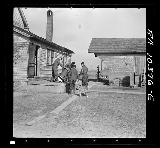 One of the last articles to be moved from the house during the moving operations of Everett Shoemaker, tenant farmer. Near Shadeland, Indiana