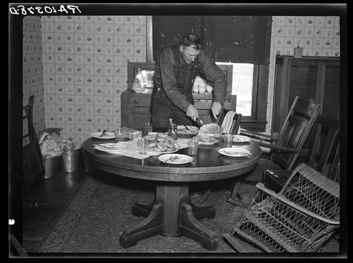 Everett Shoemaker is serving lunch to the neighbors who helped him during moving operations. Shadeland, Indiana