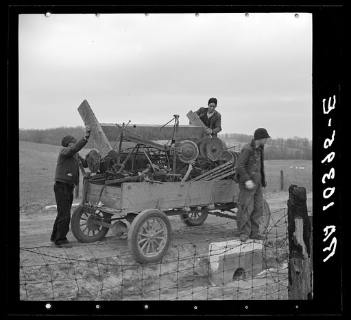 Loading farm implements bought at Frank Sheroan's closing-out sale. Near Montmonenci, Indiana