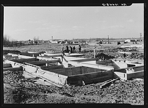 Men working on the foundations of a house at the Greenhills project. Ohio