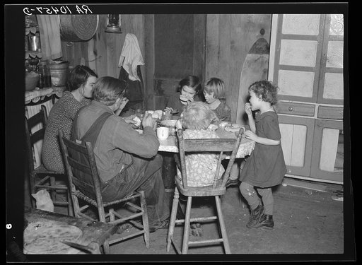 Oscar Gaither and family eating dinner. He is a tenant farmer near McLeansboro, Illinois