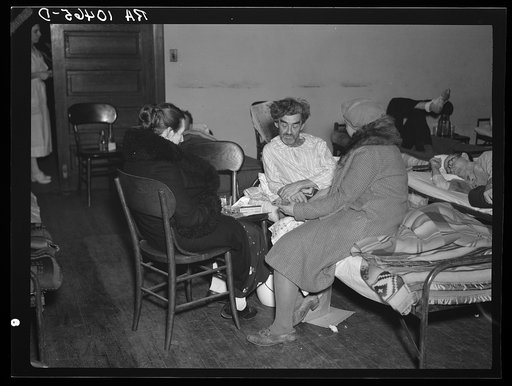 Visiting days in an improvised hospital in the church housing flood refugees at Sikeston, Missouri