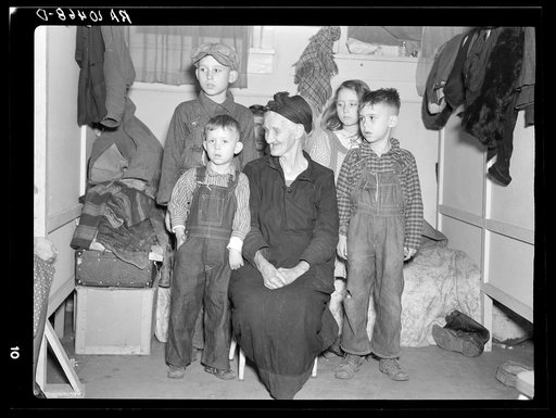 Group of children being cared for by an old lady; all of them flood refugees. Sikeston, Missouri