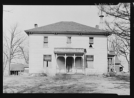 House on William Keefe's owner-operated farm near Boswell, Benton County, Indiana. Three hundred twenty acres, heavily mortgaged. Note rotting roof on the two porches
