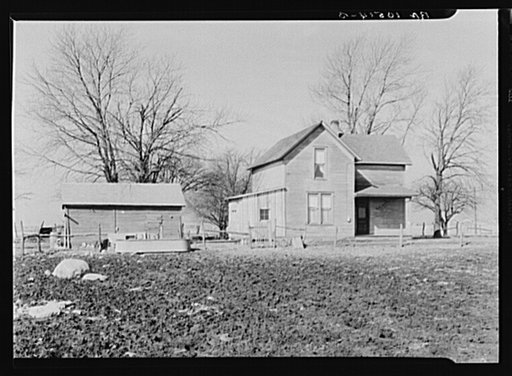 House and outbuilding on the farm of Sylvester Garring, tenant. Near Fowler, Indiana. Garring has had to make and pay for many repairs about the farm. The absence of a windmill makes it necessary for him to use an engine for pumping water--an additional expense