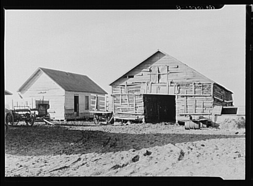 A corncrib which has needed repair for thirty-two years on the farm rented by August Feck. Feck has been a tenant on this farm for the past twelve years, but has never been given more than a one year lease. Near Templeton, Indiana