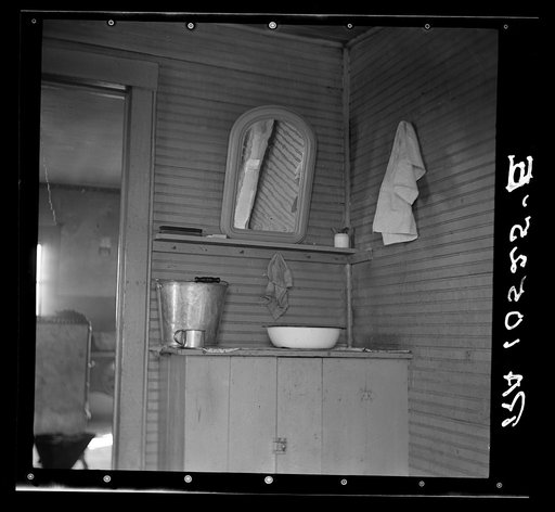 Washing facilities in the home of Elmer Johnson, hired farmhand. Near Battle Ground, Indiana. His employer has a bathroom in a modern house