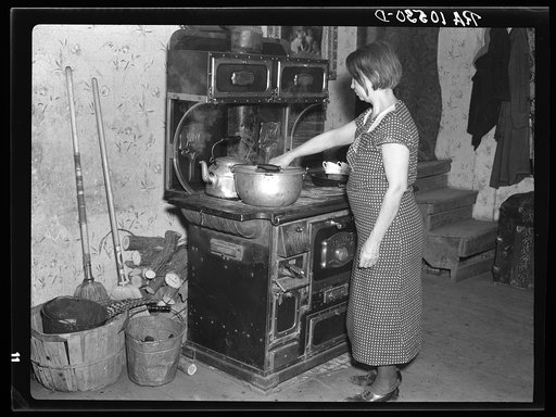Mrs. Erasty Emrich in her kitchen. Mrs. Emrich is the wife of a tenant farmer and mother of twelve children, eleven of them living. Near Battle Ground, Indiana