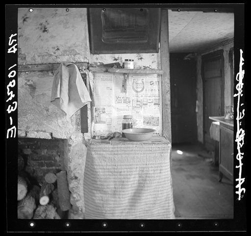 Washroom in the living room in the home of Erasty Emrich, tenant farmer. Near Battle Ground, Indiana