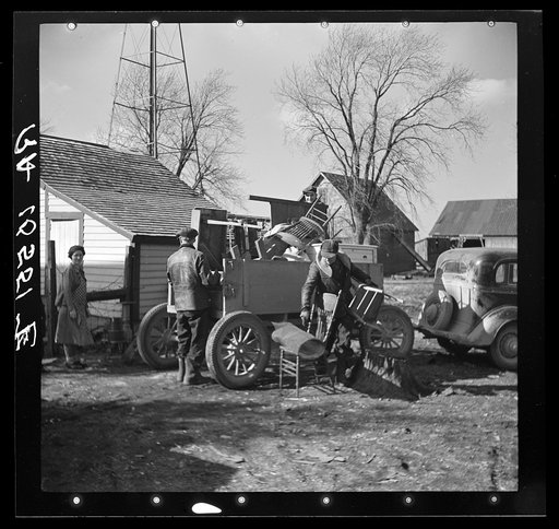 Charles Miller, for twelve years a hired farm hand, moving his household goods onto the farm he has now rented to work for himself. Northeast of Fowler, Indiana