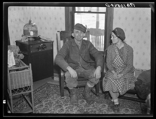 Charles Miller and his wife pausing in the midst of moving operations. New Fowler, Indiana