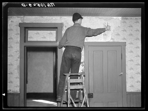 Clifford Rowe, twenty-six year old tenant farmer, who is going to repaper the rooms of the house he has just moved into. Near Templeton, Indiana