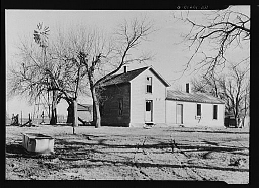 Unoccupied farmhouse on a farm near Fowler, Indiana. This farm is rented by a large operator and the land is cultivated