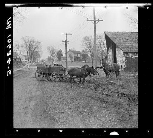 Horses and wagon tied to hitching post. Joy, Illinois