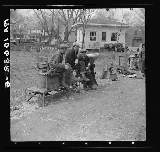 Group of farmers and articles for sale outside the sales pavilion at Aledo, Illinois