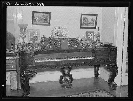 Old square piano in a home at Eldorado, Illinois