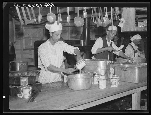 Preparing dinner for the six hundred fifty flood refugees encamped at Tent City near Shawneetown, Illinois