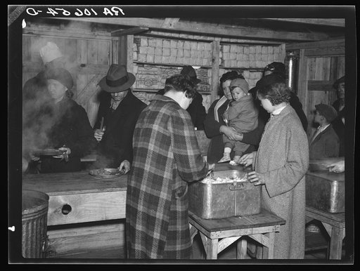 Flood refugees being fed at Tent City, near Shawneetown, Illinois. The people serving food are volunteers from among the flood refugees