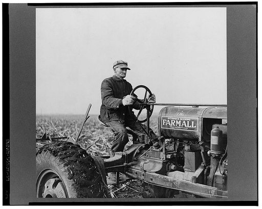 Tip Estes operating a tractor. Near Fowler, Indiana