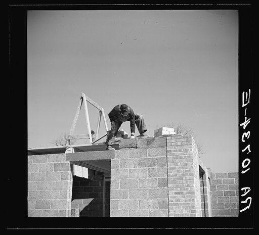 Putting cinder blocks in place at Greendale, Wiscsonsin