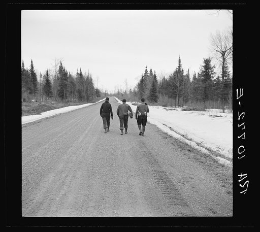 Lumberjacks walking to town after the winter work is finished. Forest County, Wisconsin