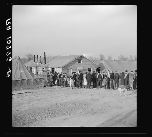 Men, women and children waiting in line to be fed. Tent City, Shawneetown, Illinois